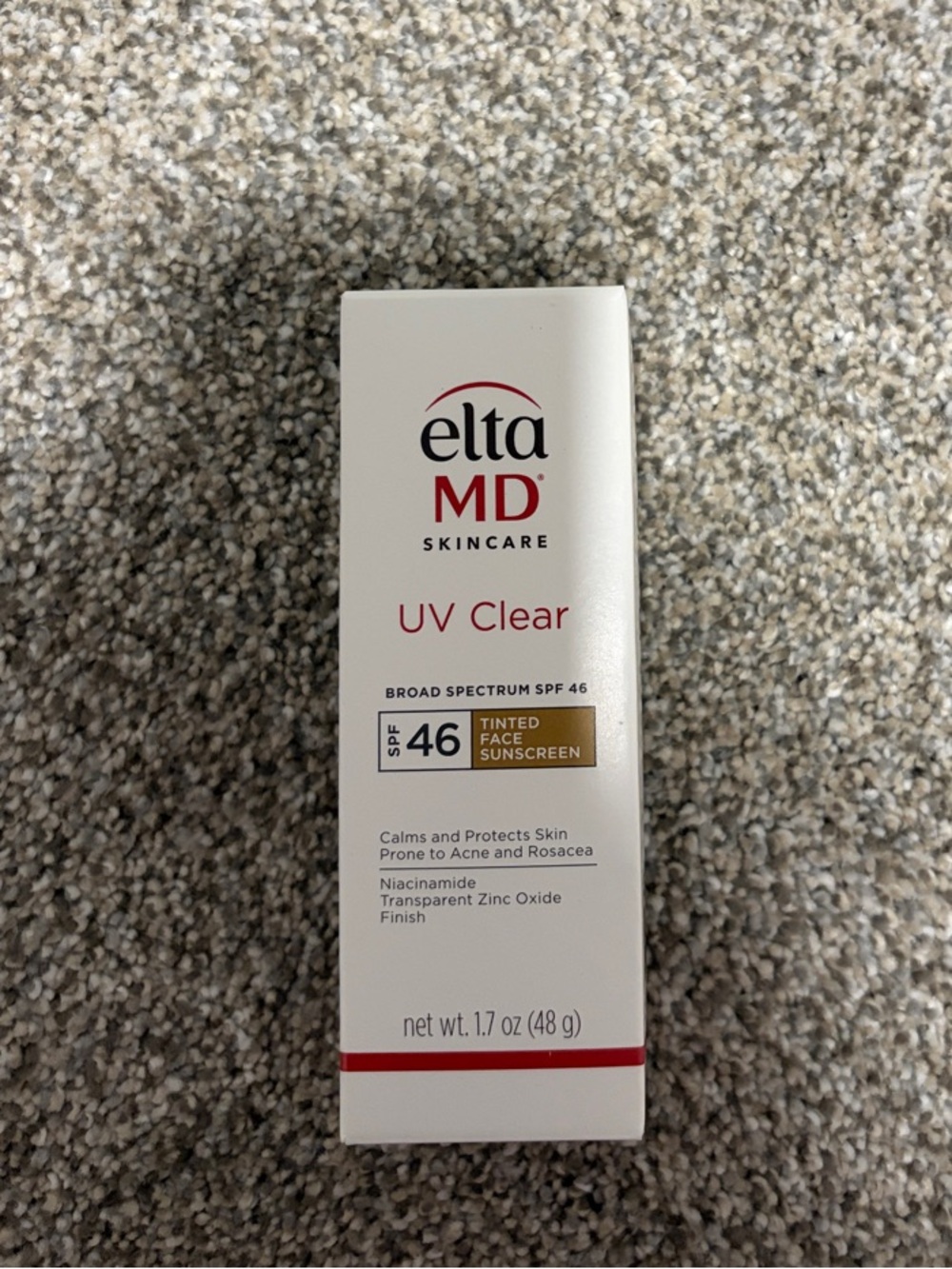 EltaMD UV Clear Tinted Face Sunscreen - White Box with Red and Gold Accents